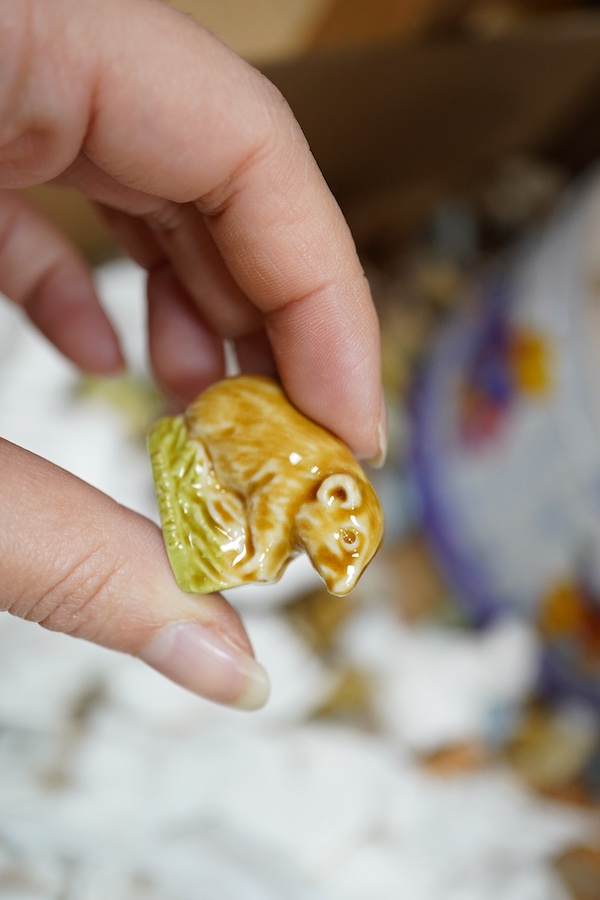 A large collection of Wade Whimsies including Disney Characters and a collection of blown glass animal figures